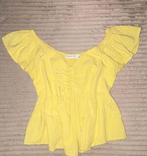Midnight Sky Yellow Ruched Front Peplum Top